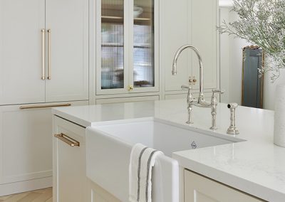 Image of Lyons Construction Rougemount Project. Image shows island sink of newly renovated kitchen.